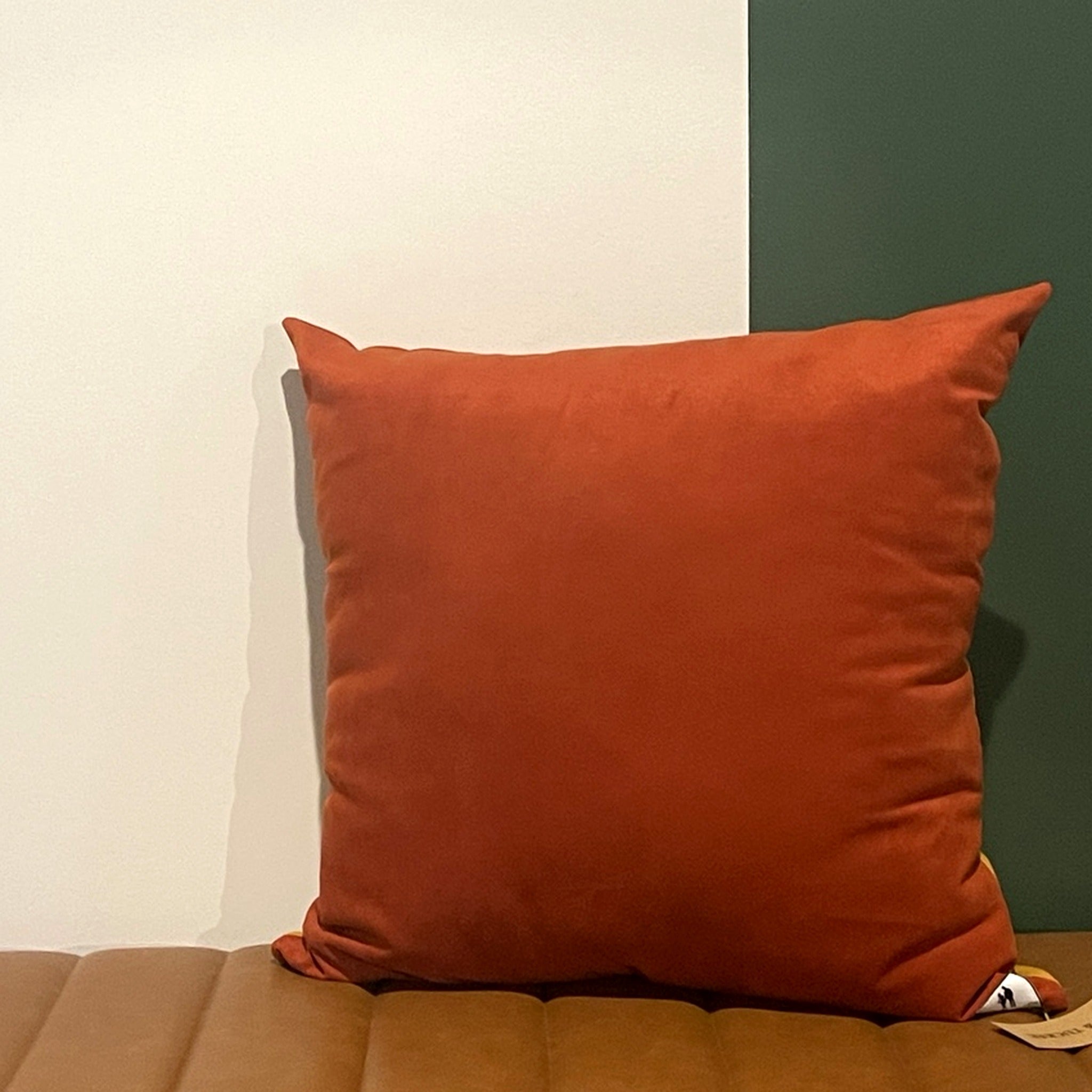 NO.001 Studio Pillow – Golden Rust Block reverse view showing coordinating neutral fabric and Toni & Tucker label.