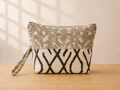 Back view of NO.002 Studio Pouch – Olive Grove with neutral patterned panels and matching wrist strap.