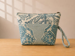 Back view of NO.004 Studio Pouch – Garden Pavilion with green and blue ornamental textile panels and matching wrist strap.