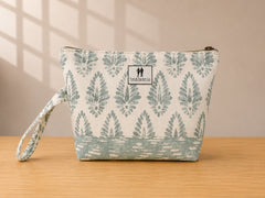 Front view of NO.006 Studio Pouch – Mist Fern with soft blue gray textile, label, zipper closure, and wrist strap.
