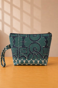 Back view of NO.008 Studio Pouch with blue patterned fabric and wrist strap.