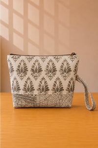 Back view of NO.009 Studio Pouch Sandstone Key with neutral patterned fabric and matching wrist strap.